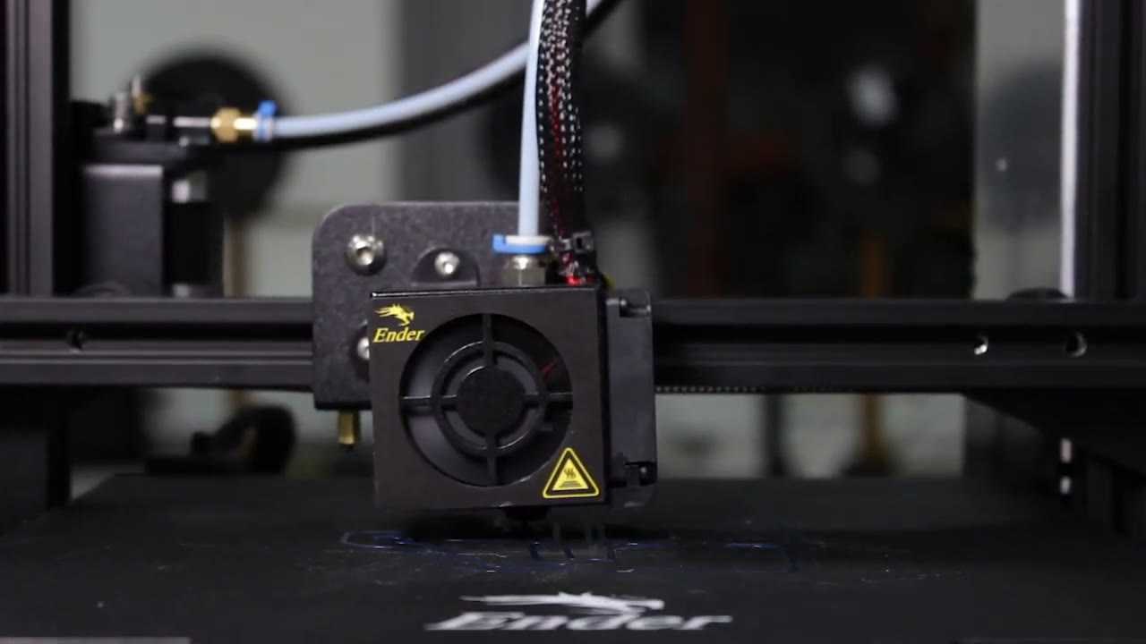 Close-up of a 3D printer toolhead in the school's lab